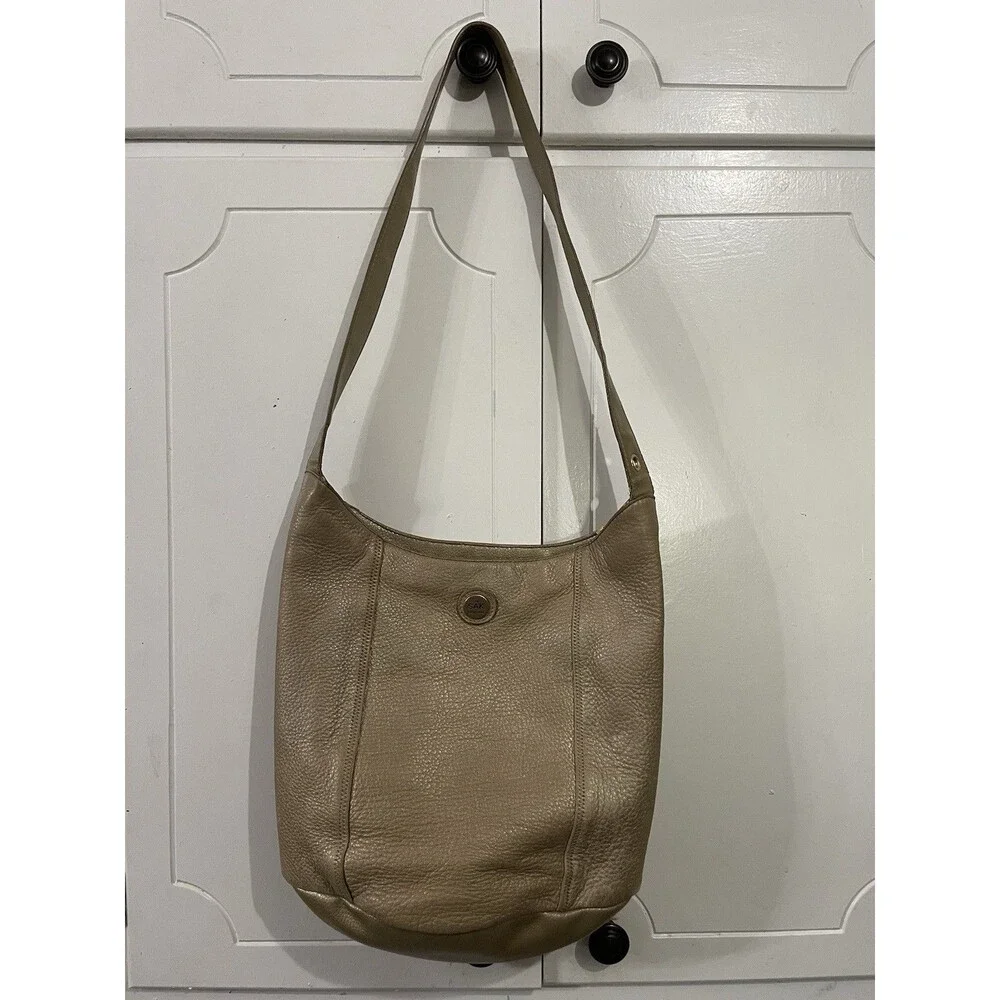 The SAK Gold Pebbled Leather Hobo Shoulder Bag Purse Single Strap Handbag